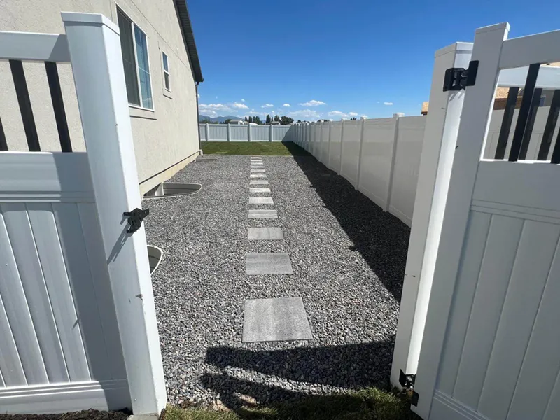 side yard with an inviting pathway and clean look