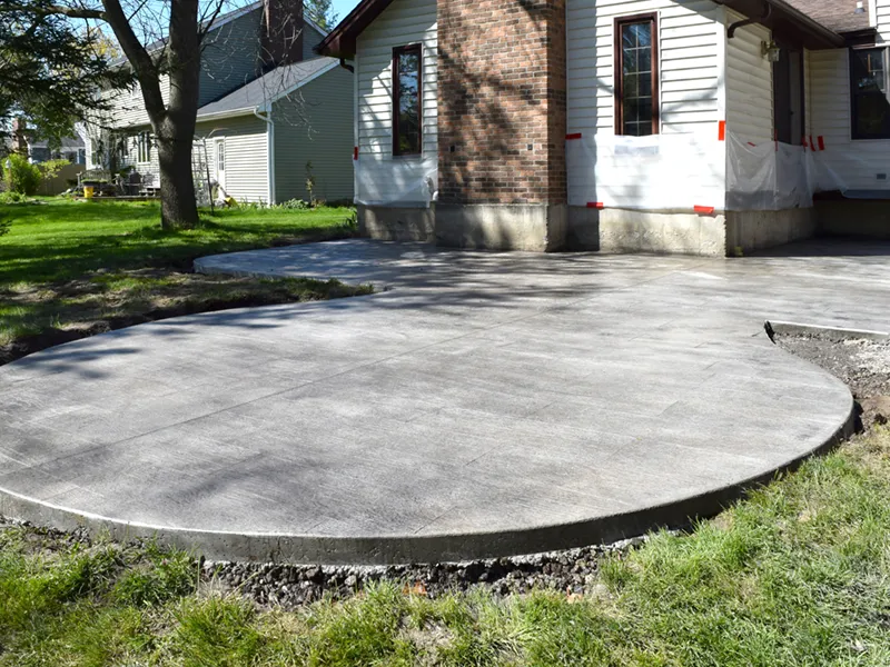 new home backyard rounded concrete patio